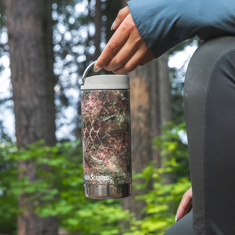 12oz-tkwide-with-twist-cap-mossy-oak-w0 12oz_tumbler_mossyoak_rainbowtrout_hand_closeup_square.jpg
