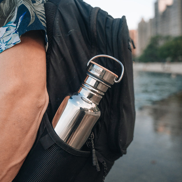 27oz-reflect-with-bamboo-cap-d5 K27SSLRF-MS-BAMBOO_reflect-bottle_backpack_lifestyle.jpg